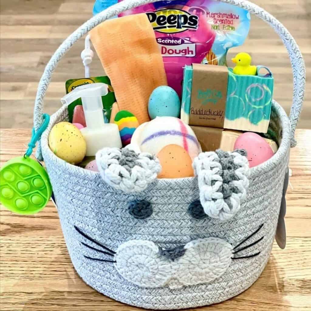 Basket filled with self care kit such as ball bomb bath, lotion, and scented soap bars